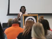 woman speaking at podium